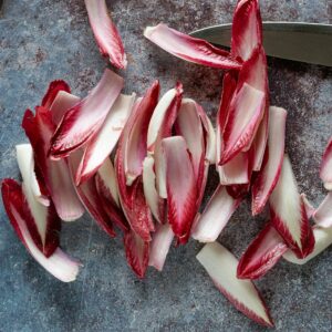 red and white plastic flower petals on gray concrete floor